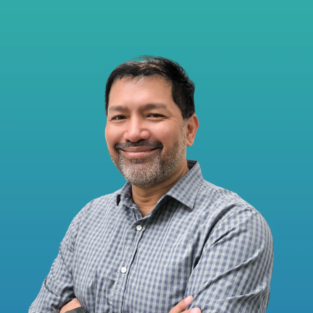 Rubin Khoo, our clinical psychologist is wearing black shirt and smiling