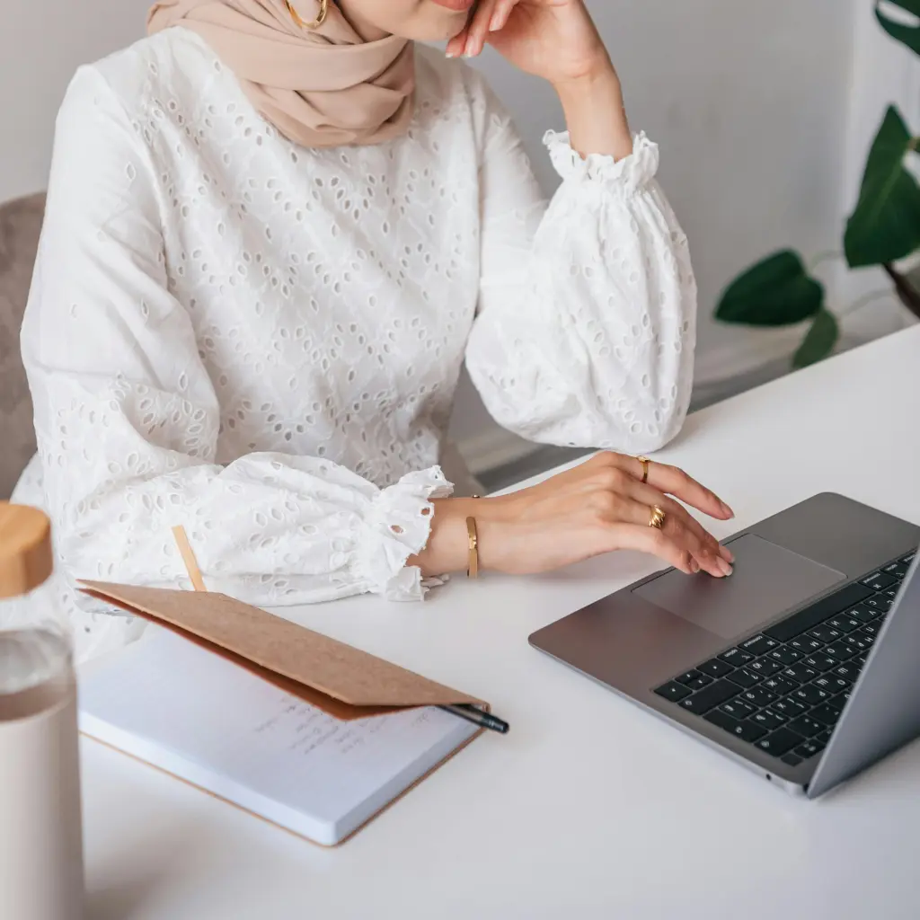 Person is attending a session via a laptop at a desk