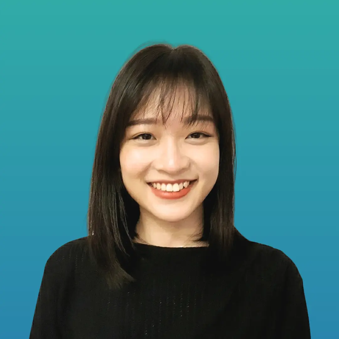Our Registered Clinical Psycholologist YY, with black hair smiling against a soft teal background.